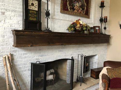 This massive fireplace had great potential, but nothing made sense or had balance. DEETAILS designed, built and installed this beautiful 11 foot  mantle to add substance and balance, creating a clean and more inviting living  space. 